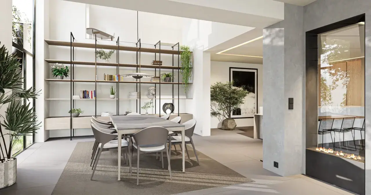 Une salle à manger moderne et lumineuse, avec une grande étagère murale, une table et des chaises, et une cheminée design. Cette **petite extension de maison** est un espace de vie accueillant.