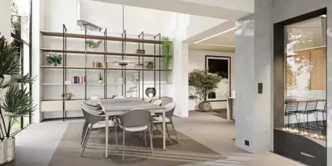 Une salle à manger moderne et lumineuse, avec une grande étagère murale, une table et des chaises, et une cheminée design. Cette **petite extension de maison** est un espace de vie accueillant.