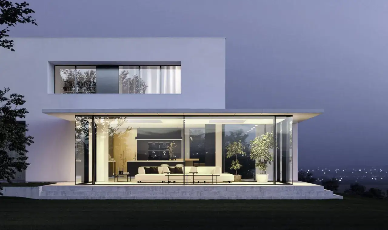 Maison moderne avec extension sur toit plat existant, salon lumineux avec baies vitrées donnant sur un jardin.