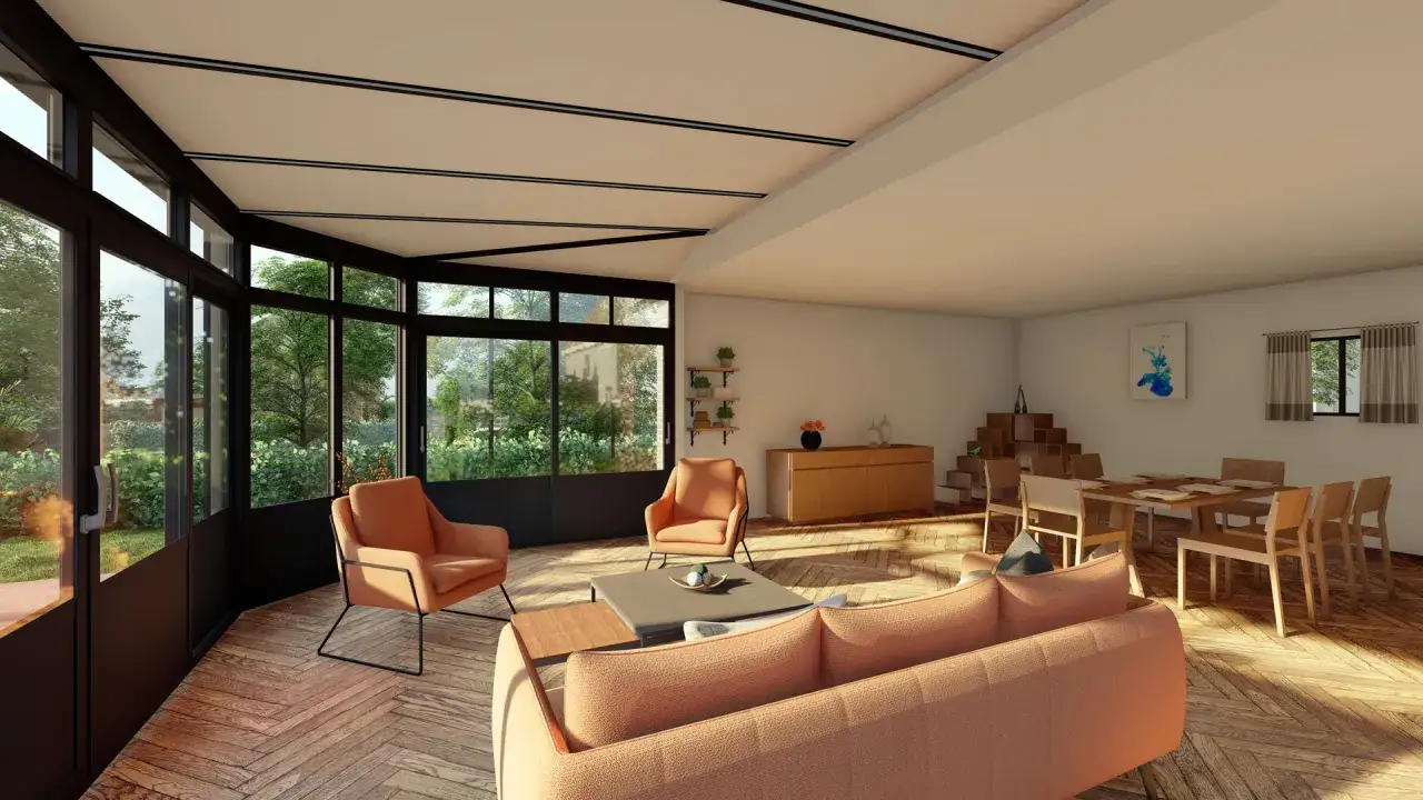 Salon lumineux avec de grandes baies vitrées donnant sur un jardin luxuriant. Mobilier moderne et parquet en chevrons. Un bâtiment sans permis de construire qui invite à la détente.